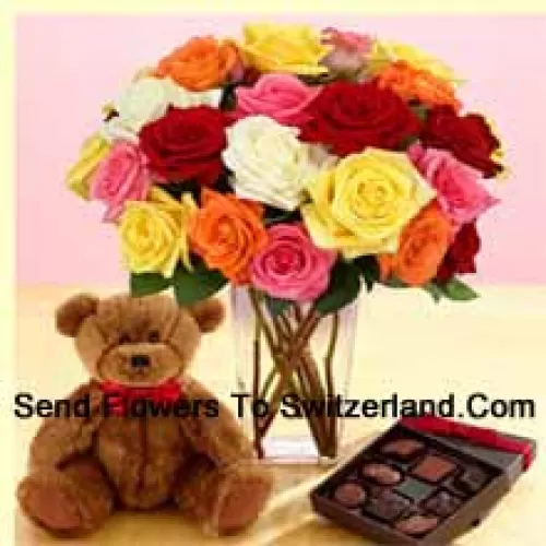 25 Mixed Colored Roses With Some Ferns In A Glass Vase, A Cute 12 Inches Tall Brown Teddy Bear And An Imported Box Of Chocolates