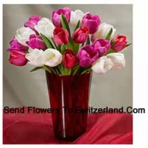 Mixed Colored Tulips With Seasonal Fillers In A Glass Vase - Please Note That In Case Of Non-Availability Of Certain Seasonal Flowers The Same Will Be Substituted With Other Flowers Of Same Value