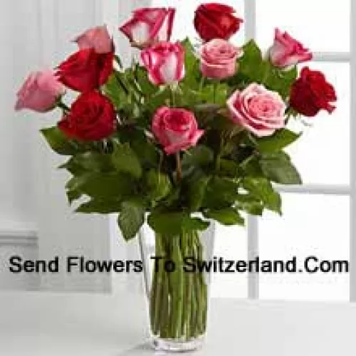 5 Red, 4 Pink And 4 Dual Toned Roses With Seasonal Fillers In A Glass Vase